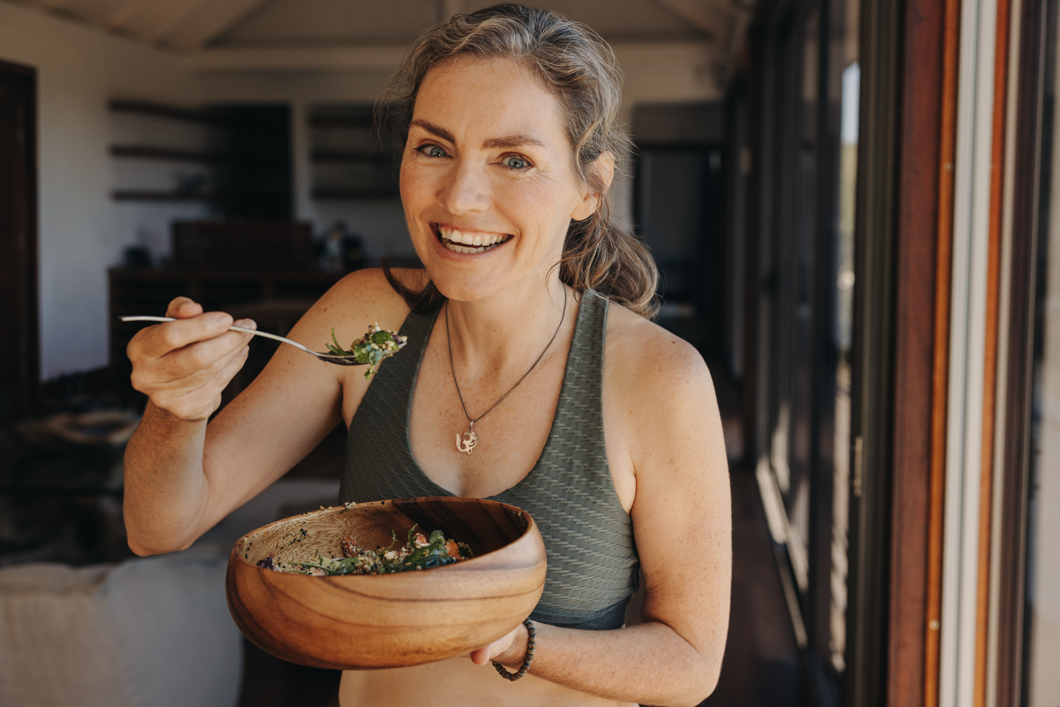 A woman eating a healthy salad